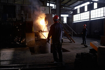 Fototapeta na wymiar Working in cast iron foundry