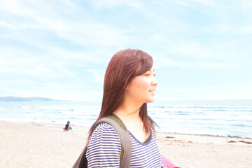 Fototapeta na wymiar Portrait of young woman at beach