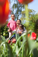 Mother with daughters in garden