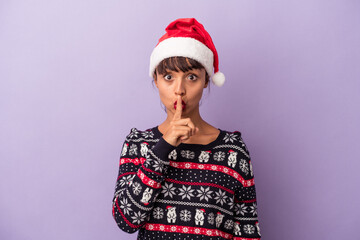 Young mixed race woman celebrating Christmas isolated on purple background  keeping a secret or asking for silence.