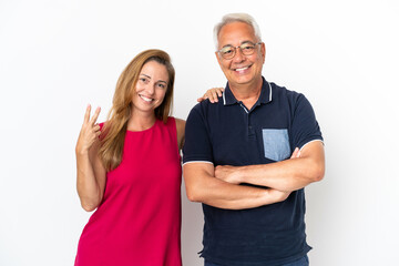 Middle age couple isolated on white background smiling and showing victory sign