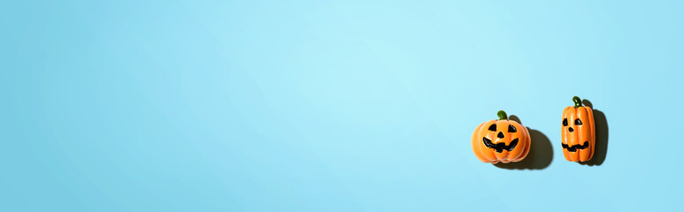 Miniature Halloween pumpkin ghosts - overhead view flat lay