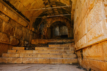 Underground passage under the old ancient city. Old stone stairs to enter the tunnel.