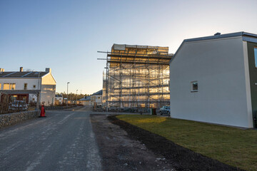 View building under construction on blue sky background. Industry concept. Sweden.