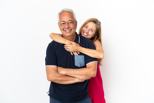 Middle Age Couple Isolated On White Background Laughing And Hugging