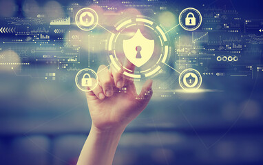 Cyber security theme with a hand pressing a button at night