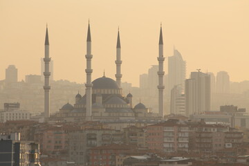 The mosque seen between the buildings, mosque view.