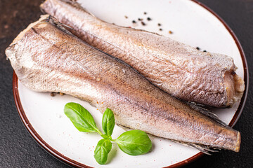 hake fish raw white fillet seafood fresh ready to eat meal snack on the table copy space food background rustic top view 