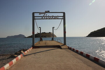 The sign at the entrance of the pier and the sea view, sea view from the pier.