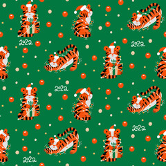 Christmas colored seamless pattern with 2022 New Years symbol. Small Tiger with garlands, christmas baubles, confetti and lettering. Flat vector illustration.