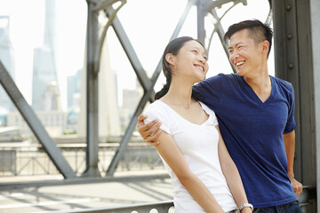 Smiling romantic tourist couple, The Bund, Shanghai, China