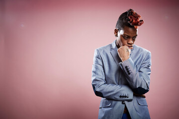 Portrait of young woman with hand on chin and thoughtful expression