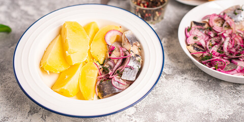 herring and potatoes second course marinated fish onion fresh ready to eat meal snack on the table copy space food background rustic