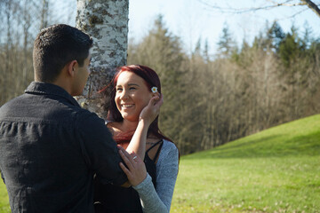 Naklejka premium Romantic young couple in park