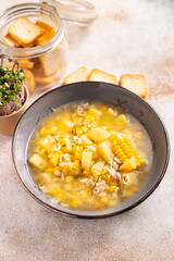 corn soup vegetarian first course vegetable potatoes, pasta alphabet, veggie broth no meat fresh portion meal snack on the table copy space food background rustic vegan 