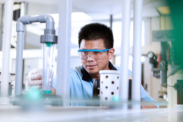 Man wearing safety goggles in flexible electronics plant