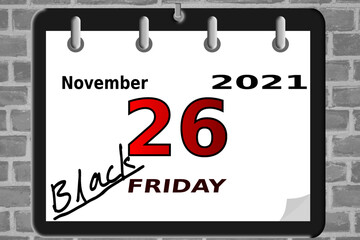 Wall calendar with the date of Black Friday with hand description BLACK