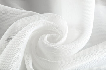 milky white neoprene fabric coiled