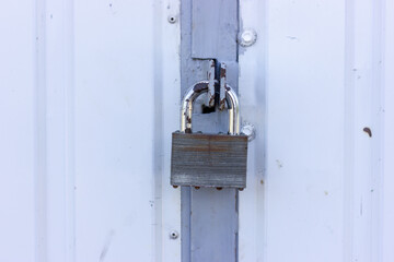 Padlock on iron doors. Locked doors. Iron gates.
