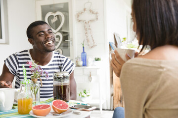 Young couple sharing breakfast together