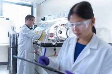 Scientists working in crystal engineering research laboratory