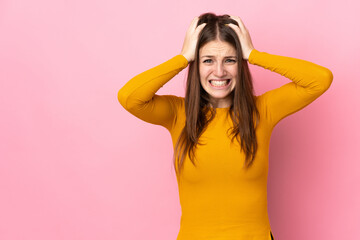 Young caucasian woman isolated on pink background doing nervous gesture