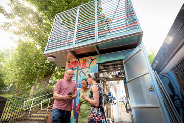 Community workers using smartphone app to check heat pump energy