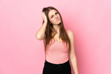 Young caucasian woman isolated on pink background with an expression of frustration and not understanding