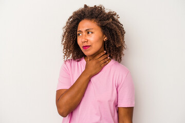 Young african american woman with curly hair isolated on white background touching back of head, thinking and making a choice.