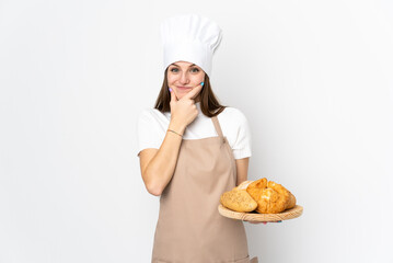 Young woman in chef uniform isolated on white background laughing