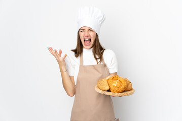 Young woman in chef uniform isolated on white background unhappy and frustrated with something