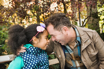 Father and daughter head to head smiling