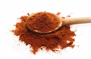 Red paprika, pepper powder pile with wooden spoon isolated on white background