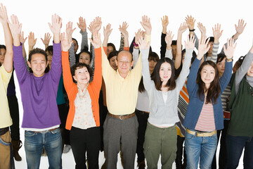 People with arms raised