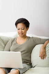 Mature woman using laptop