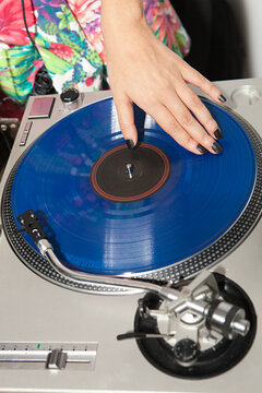 Disc jockey at party on mixing desk