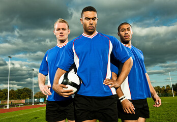 Soccer players on pitch, portrait © Image Source Limited