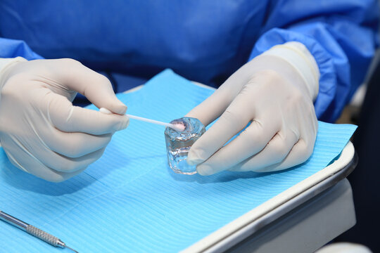 application of fluoride gel in dental patients