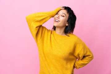 Young Uruguayan woman over isolated pink background smiling a lot