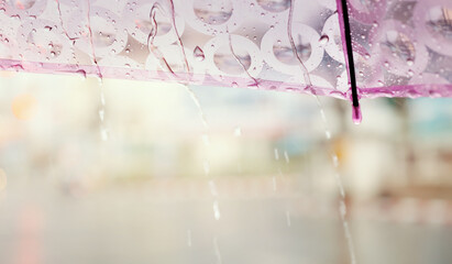 Rainy day in city with cute umbrella.City life with soft focus and very shallow depth of field.