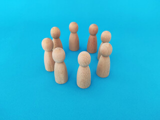 Teamwork and cooperation concept, people stand in a circle on a blue background
