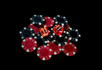 Poker dice and chips on black background. Craps club game concept. Poker game