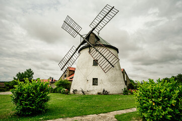 Plakat Old, wooden windmill from XIX century in a rural scenery south moravia, czech republic