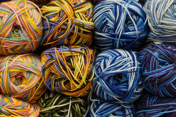 Colorful background of many yarn for handmade knitting. Knitting pattern