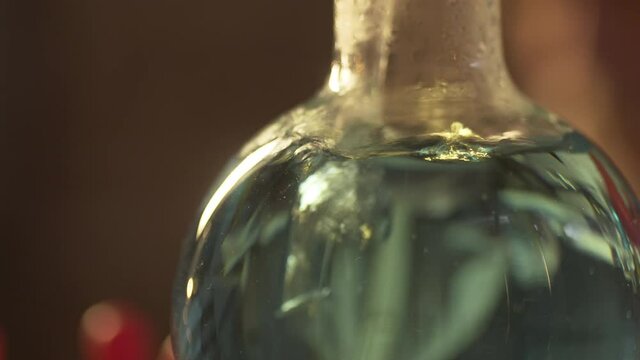 A close up of a bubbling potion in a dimly lit setting.
