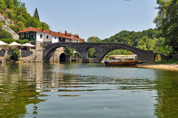 Fototapeta na wymiar Bridge over the river Chernoevich with old houses in Cetinje, Montenegro, 2021
