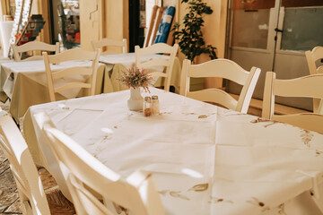 Beautiful cozy interior design of modern cafe. Table with chairs, no people. Place for gathering with friend and family.