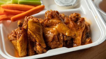 chicken wings in a carry out box