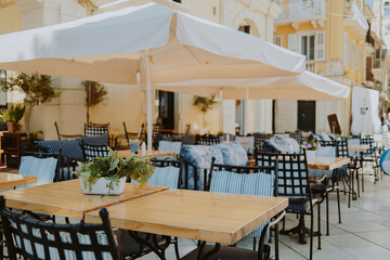 Beautiful cozy interior design of modern cafe. Table with chairs, no people. Place for gathering with friend and family.