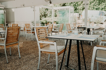 Beautiful cozy interior design of modern cafe. Table with chairs, no people. Place for gathering with friend and family.